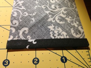 Fabric folded up to create a rolled hem